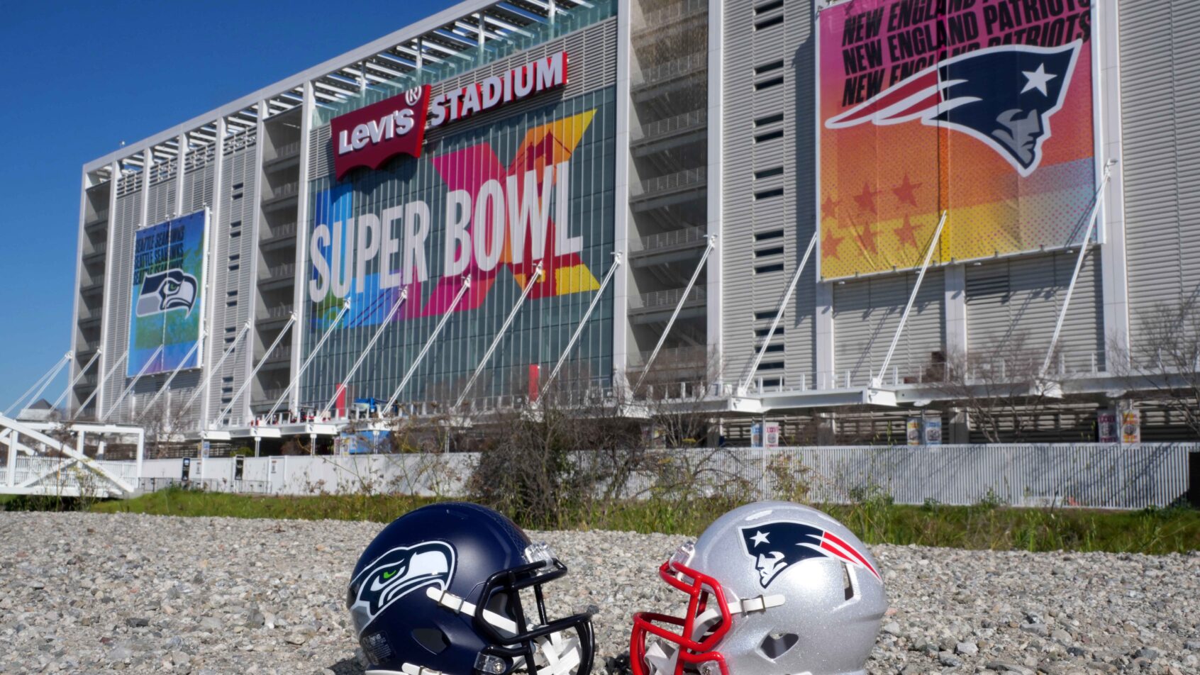 The Seahawks and Patriots' helmets outside the stadium