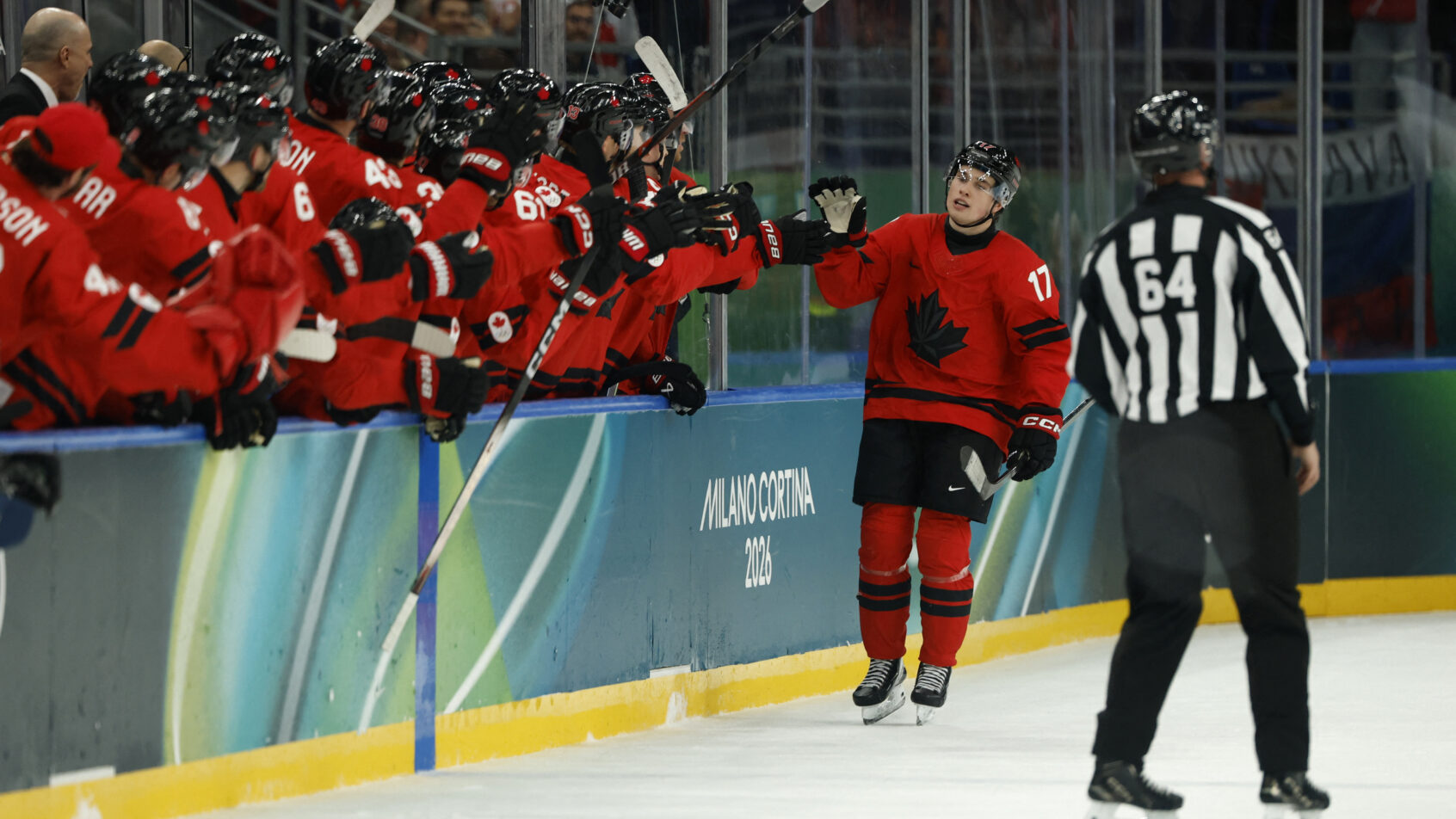 Macklin Celebrini goal celebration at bench