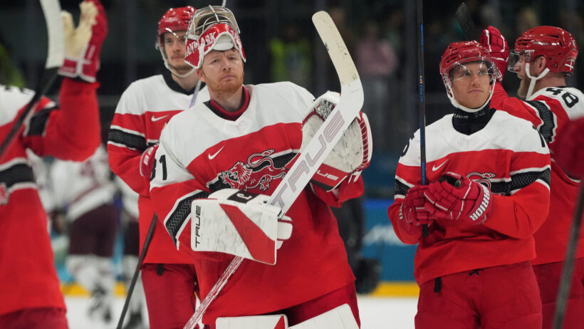 Denmark celebrates an Olympic Hockey victory over Latvia.