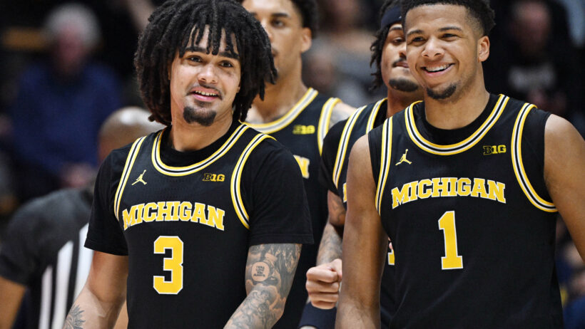 Michigan players are all smiles during a game versus Purdue.