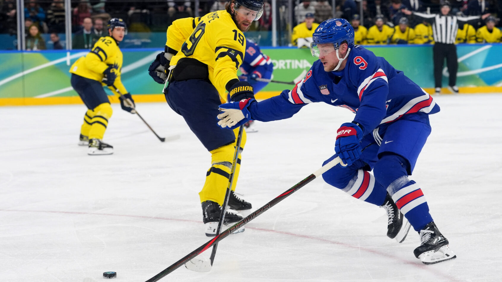 Jack Eichel skates past a Sweden defender in an Olympic hockey quarterfinal game.