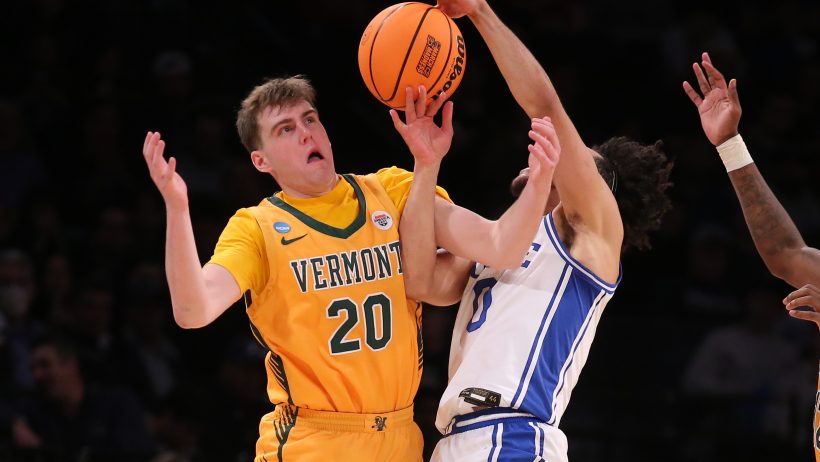 Vermont's TJ Long battles with a Duke player during the 2024 NCAA Tournament.
