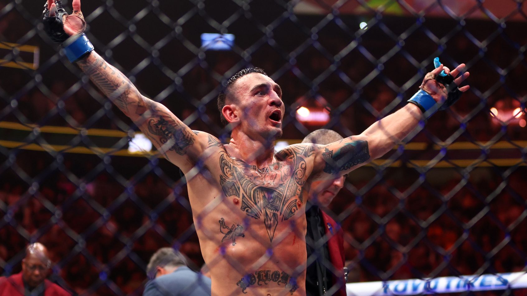 Max Holloway reacts after winning UFC fight