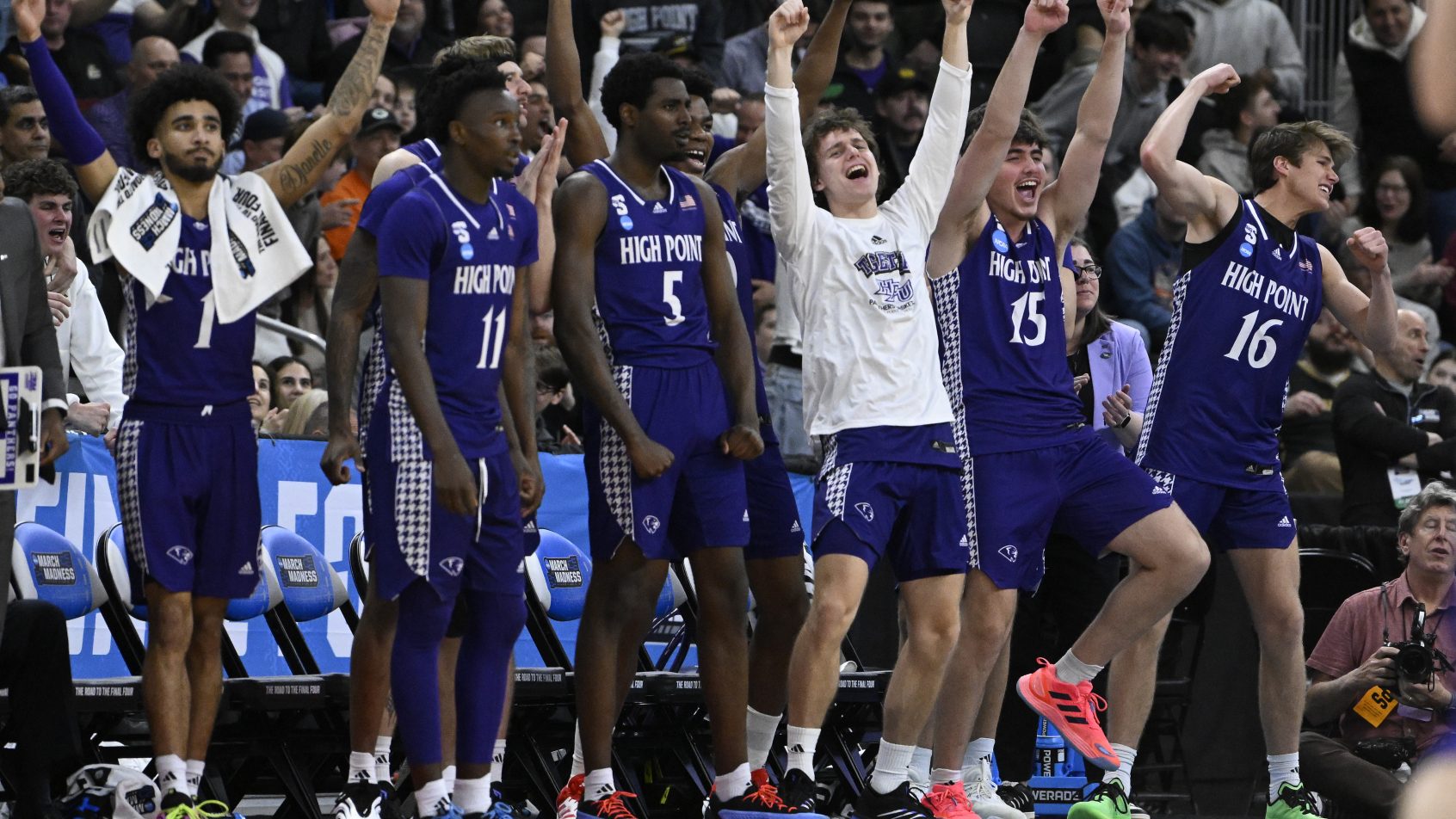 The High Point Panthers bench celebrates a bucket versus Purdue at the NCAA Tournament.