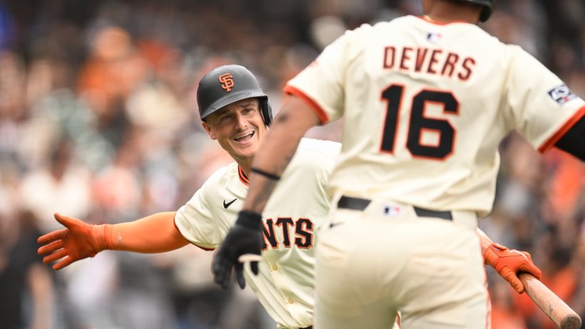 San Francisco Giants designated hitter Rafael Devers celebrates with third baseman Matt Chapman