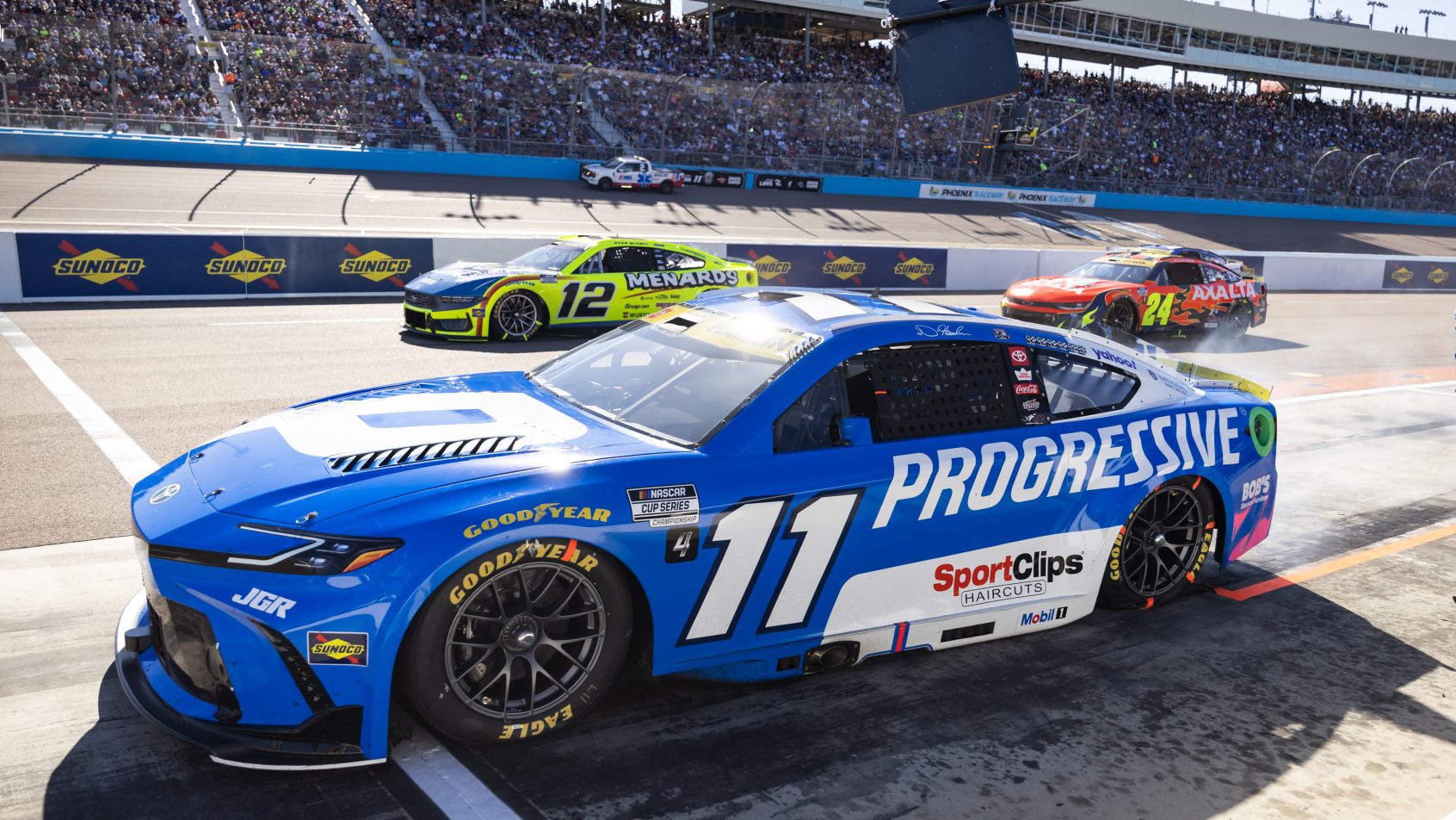 Denny Hamlin and Ryan Blaney on-track at Phoenix (2025).