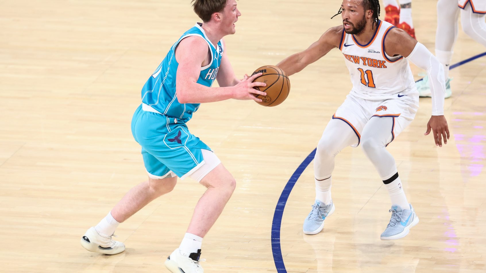 Kon Knueppel tries to drive by Jalen Brunson