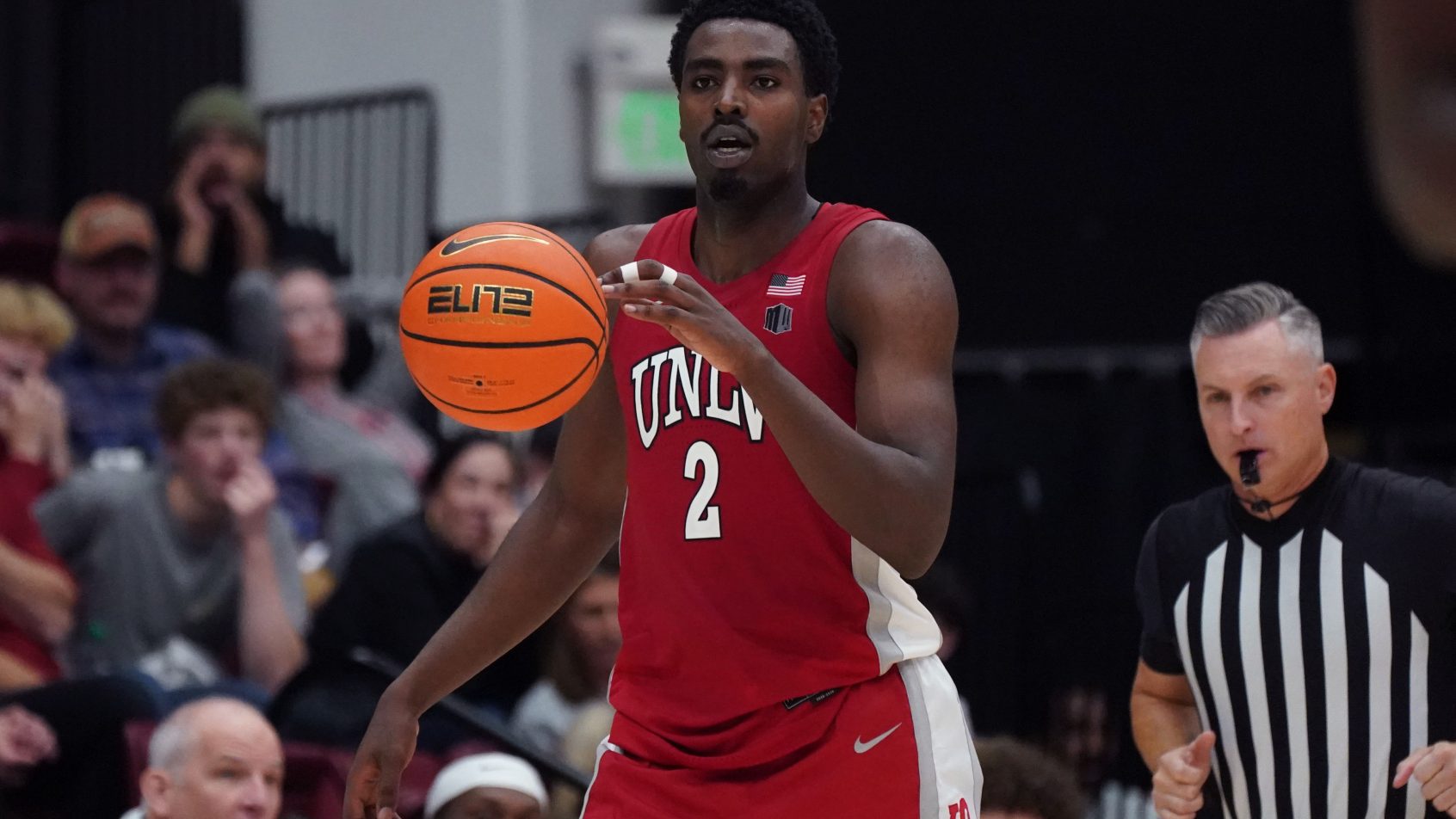 UNLV Runnin' Rebels forward Kimani Hamilton walks the ball up the court