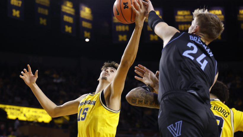 Michigan Wolverines center Aday Mara and Villanova Wildcats forward Duke Brennan go for a rebound