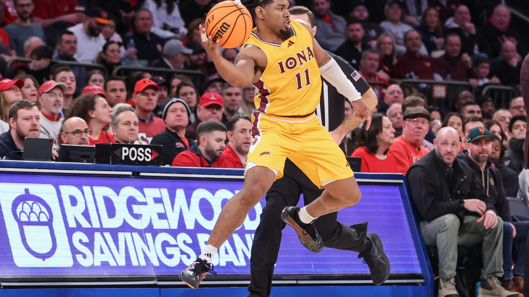 Iona Gaels guard C.J Anthony saves a ball from going out of bounds