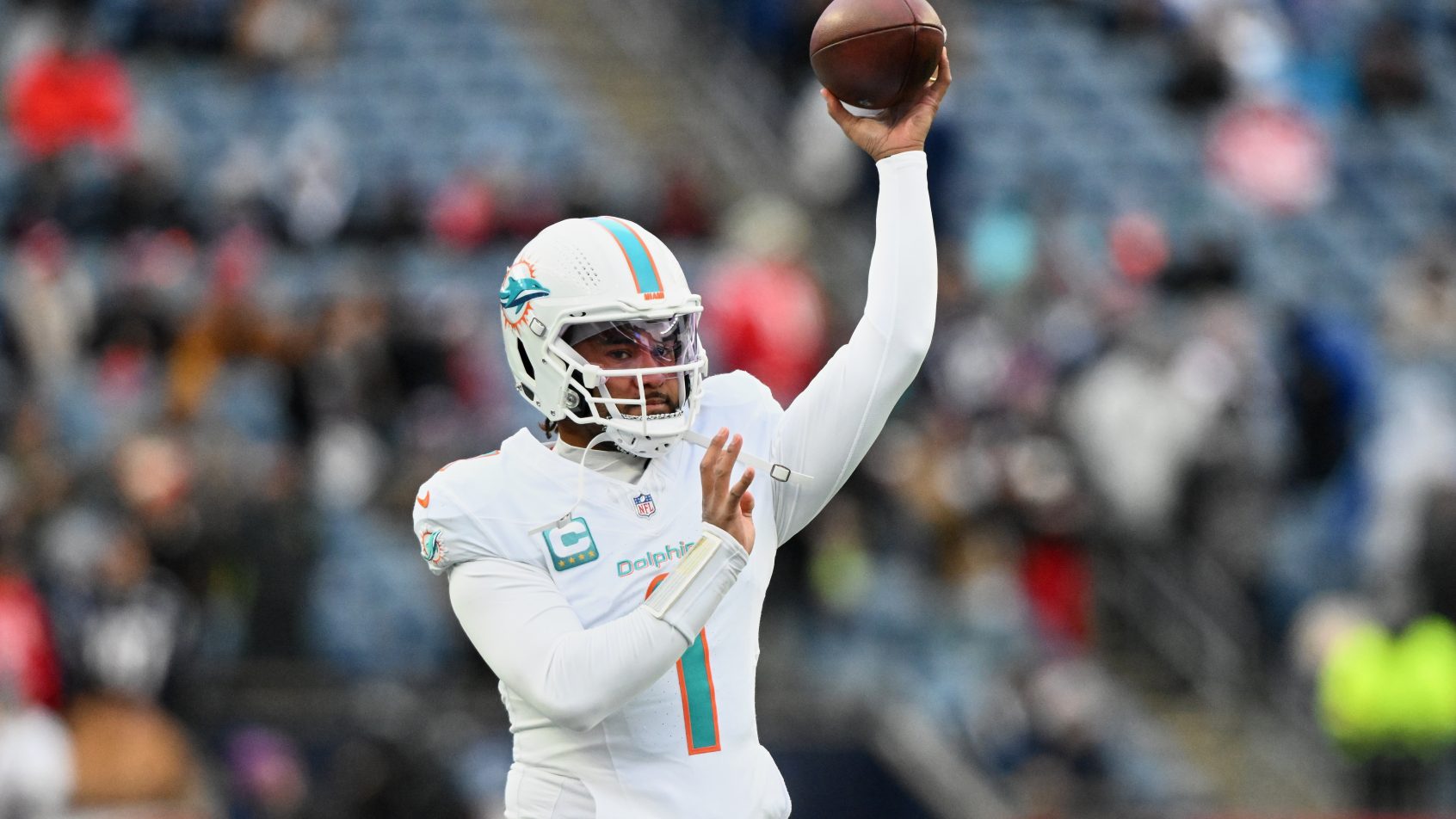 Tua Tagovailoa warms up before a game in New England against the Patriots.