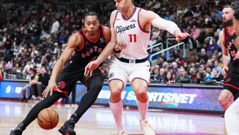 Scottie Barnes tries to score on Brook Lopez
