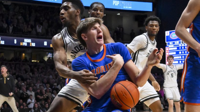 Vanderbilt Commodores forward Ak Okereke fouling Florida Gators forward Alex Condon