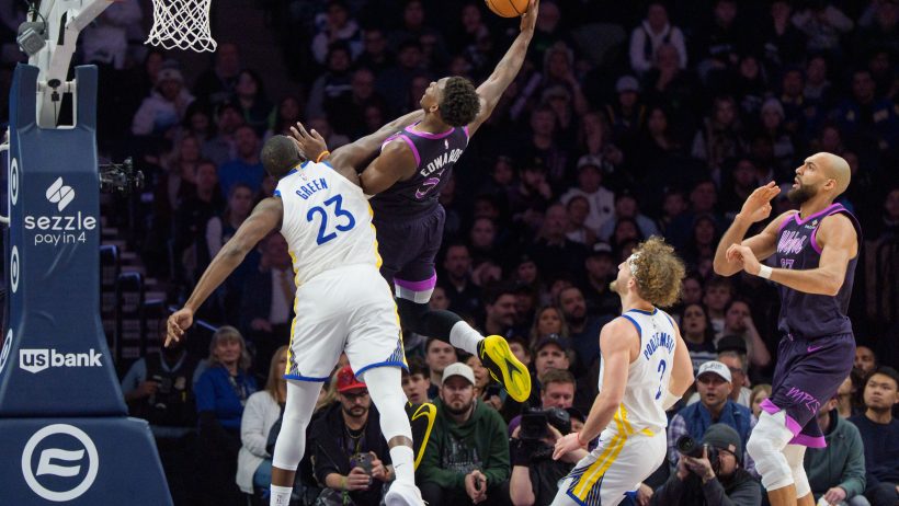 Anthony Edwards trying to score on Draymond Green