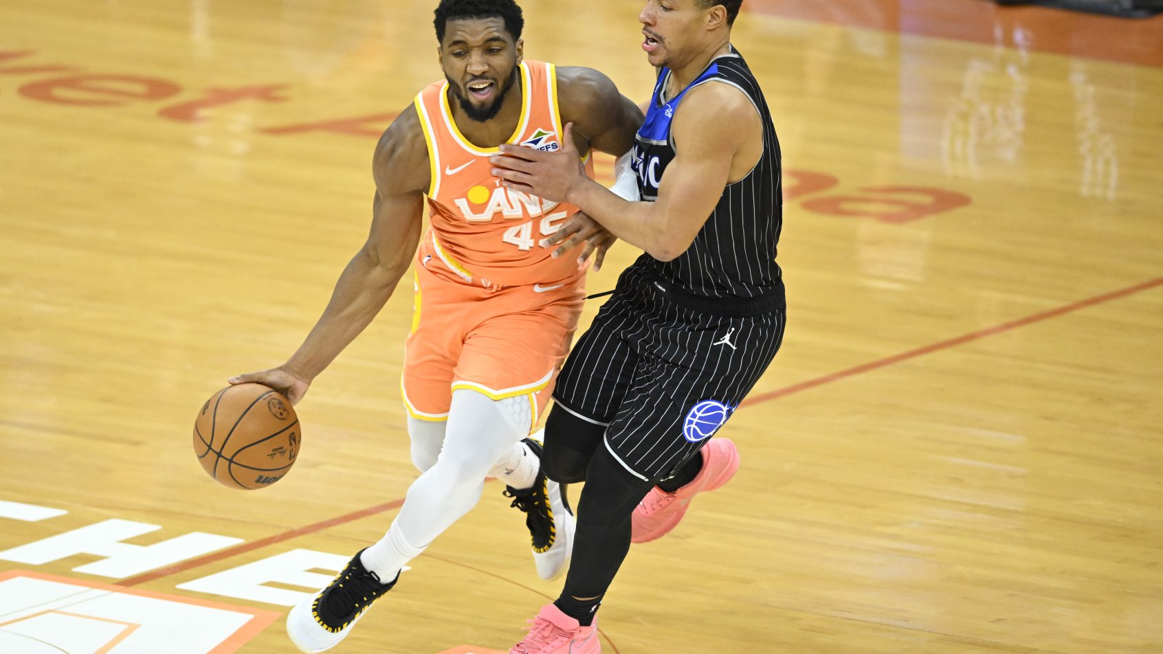 Donovan Mitchell drives by Desmond Bane