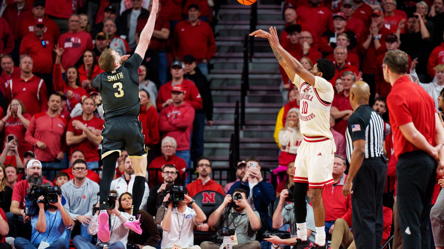 Nebraska Cornhuskers guard Jamarques Lawrence shoots a three