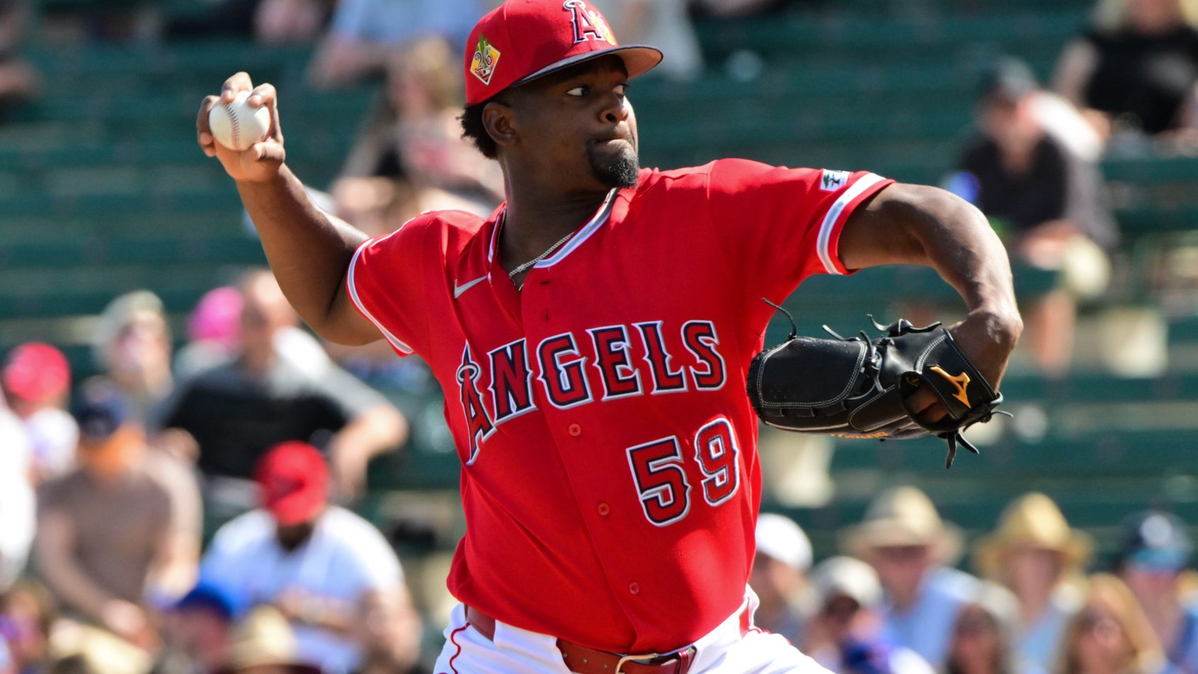 Jose Soriano delivers a pitch to a Cubs hitter during a Spring Training game.