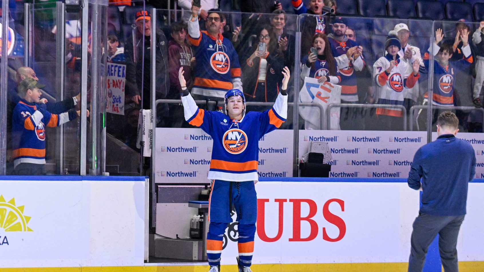 Matthew Schaefer celebrates after an Islanders victory.