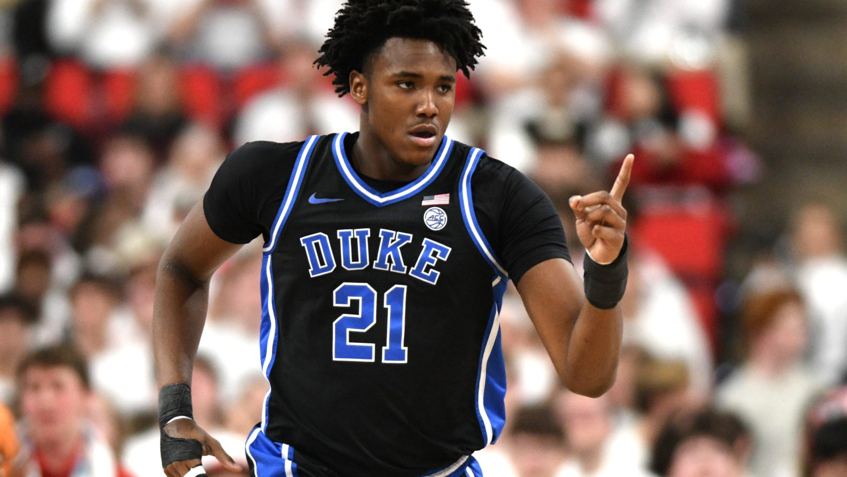 Duke Blue Devils center Patrick Ngongba II points at a teammate
