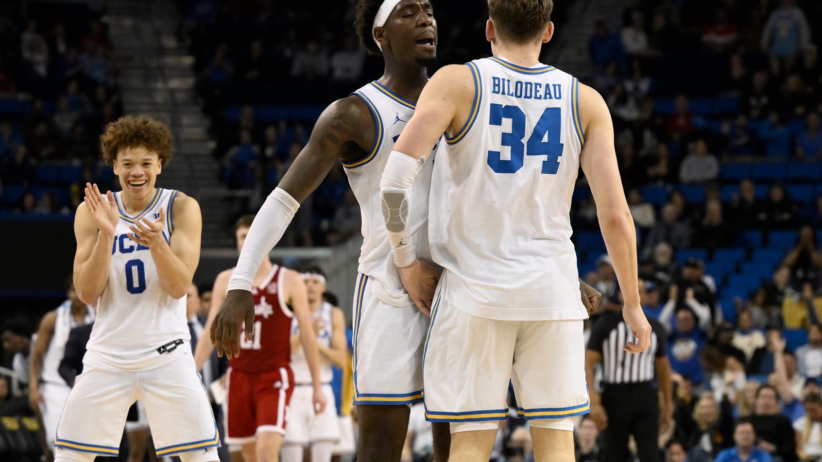 UCLA celebrates a bucket in a victory over Nebraska.