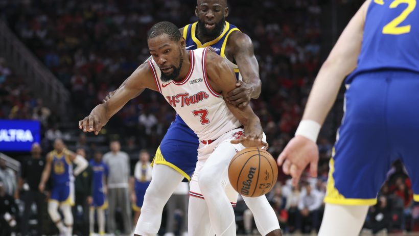 Kevin Durant is fouled by Golden State Warriors forward Draymond Green