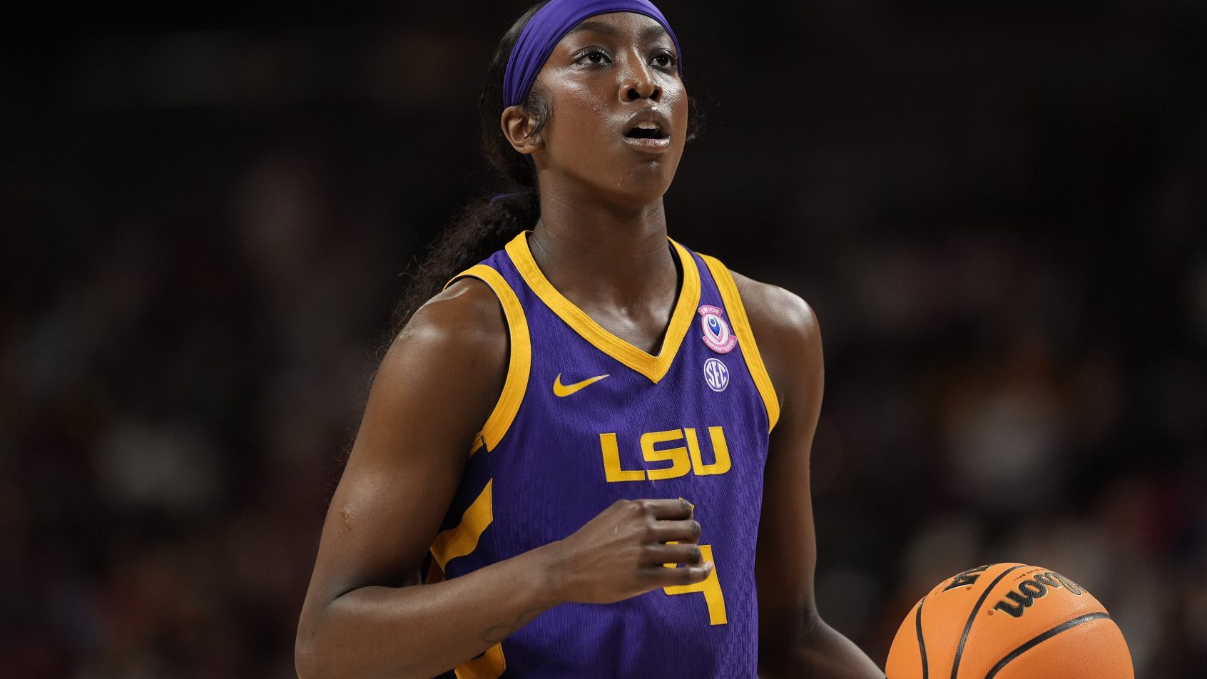 Flau'jae Johnson dribbles the ball up court versus Texas Tech at the Women's NCAA Tournament.