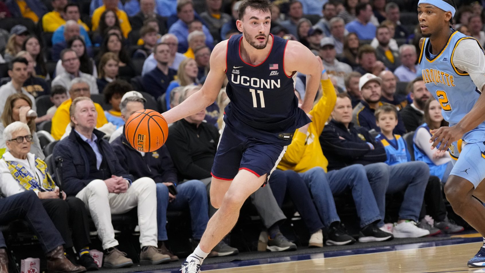 Connecticut Huskies forward Alex Karaban brings the ball up the floor