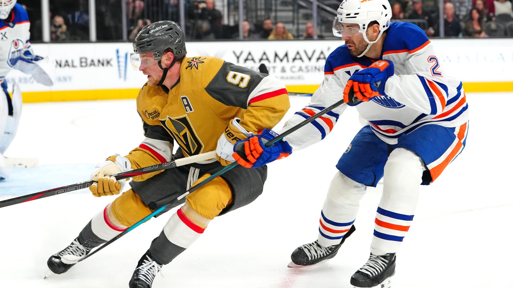 Vegas Golden Knights center Jack Eichel skates ahead of Edmonton Oilers defenseman Evan Bouchard