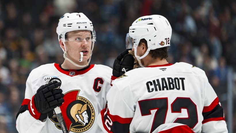 Thomas Chabot talks with Brady Tkachuk