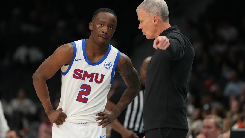 SMU Mustangs guard Boopie Miller talks with head coach Andy Enfield