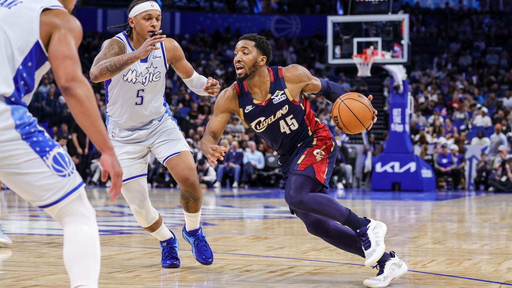 Donovan Mitchell tries to score on Paolo Banchero
