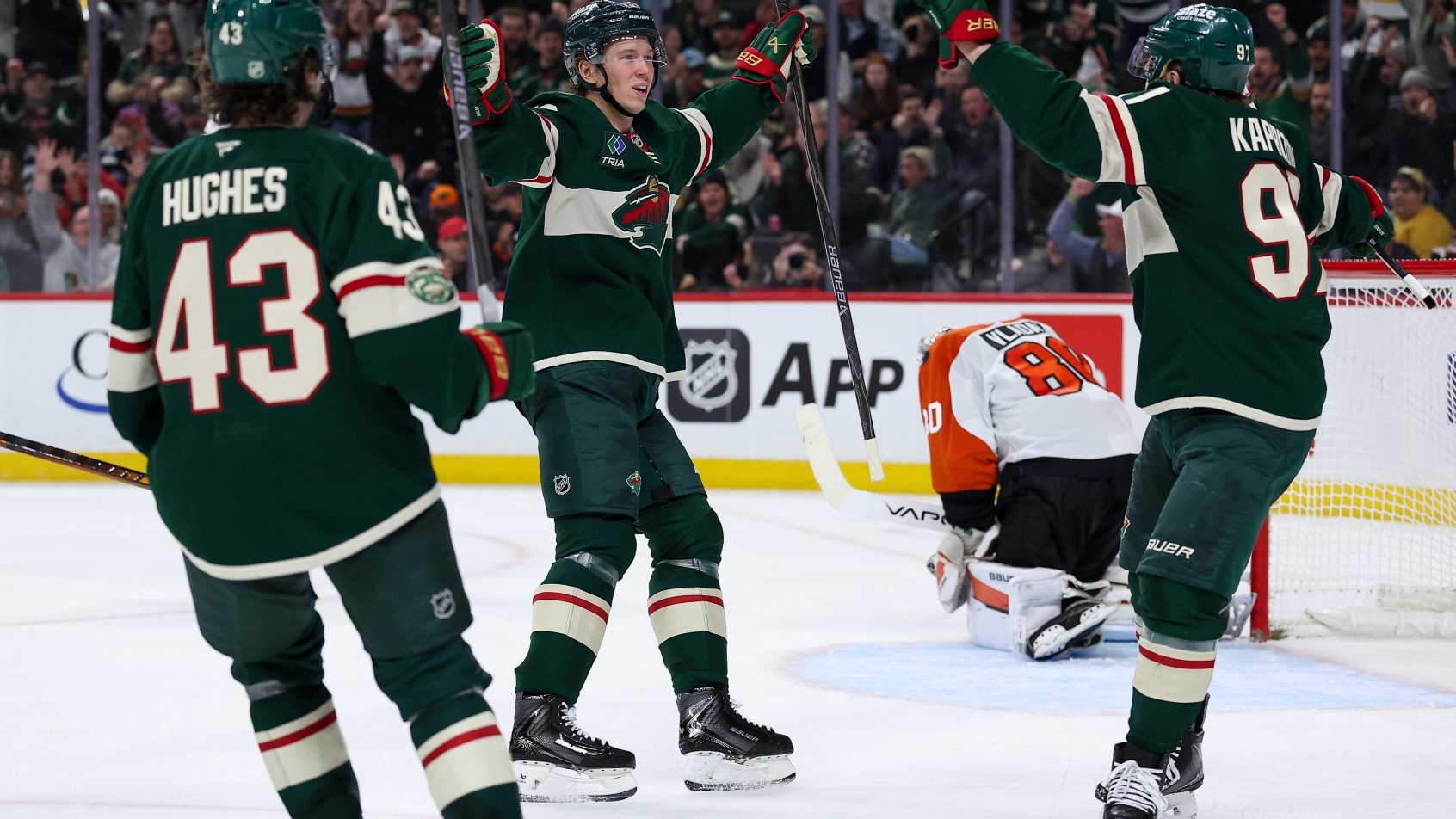 Matt Boldy celebrates a goal with his Wild teammates.