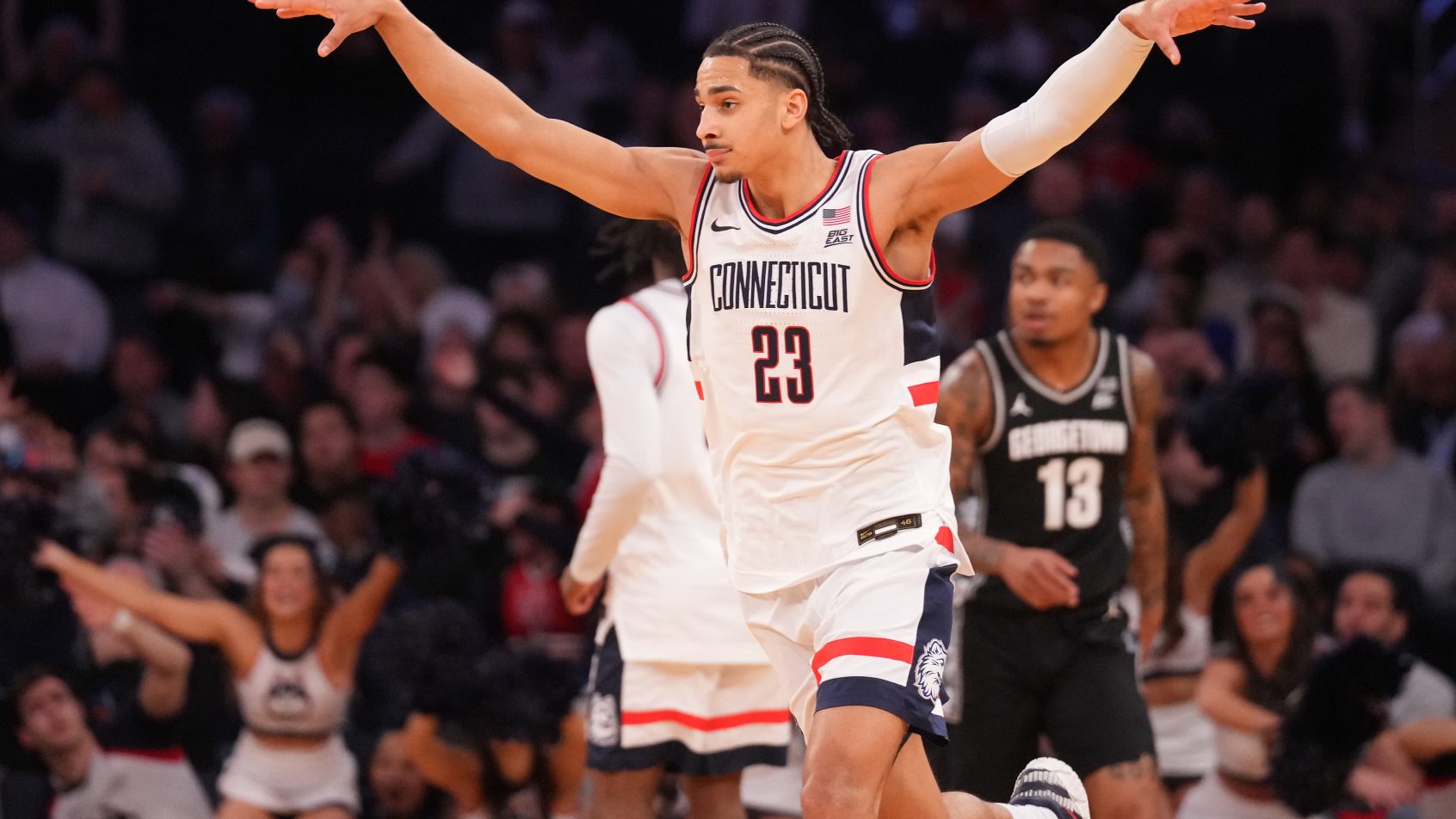 UConn Huskies forward Jayden Ross gestures after a bucket