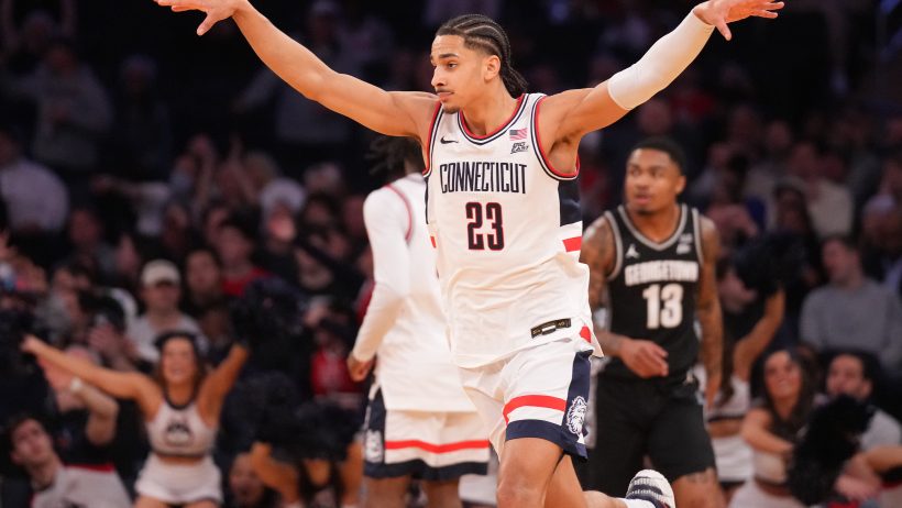 UConn Huskies forward Jayden Ross gestures after a bucket