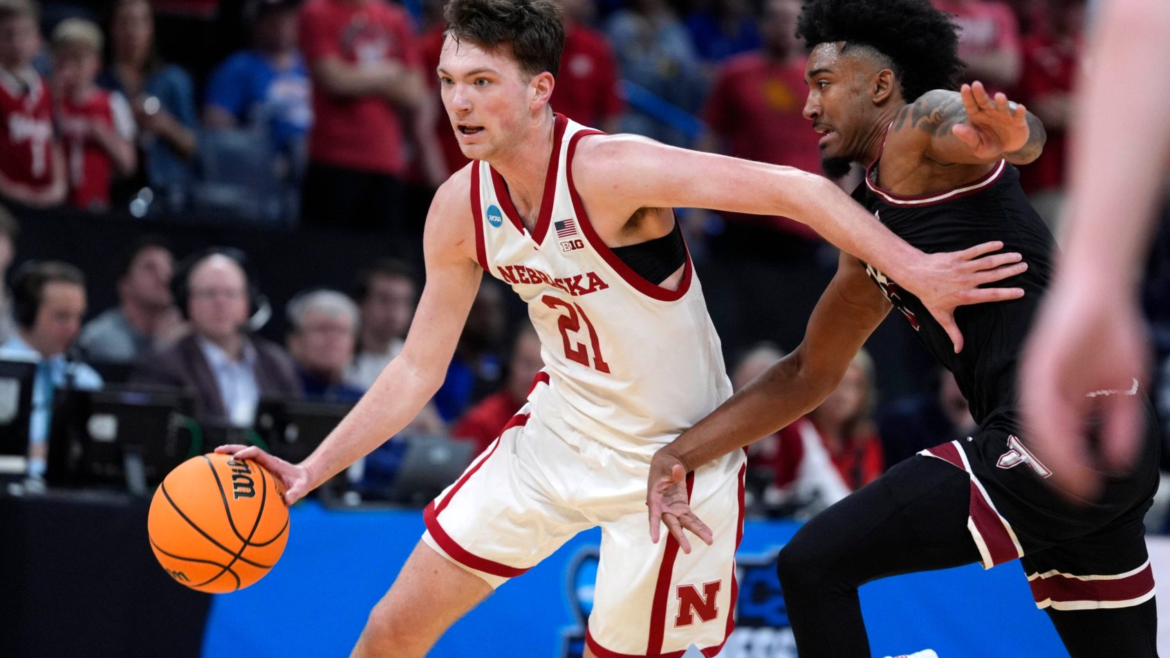 Nebraska Cornhuskers forward Pryce Sandfort drives around a defender