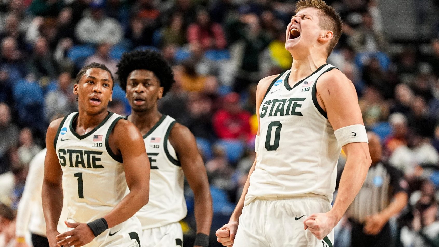 Michigan State forward Jaxon Kohler yells in a celebratory fashion