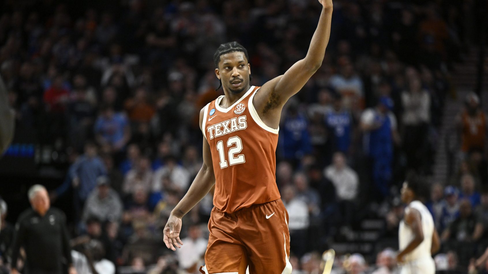 Texas Longhorns guard Tramon Mark gestures as he walks off the court