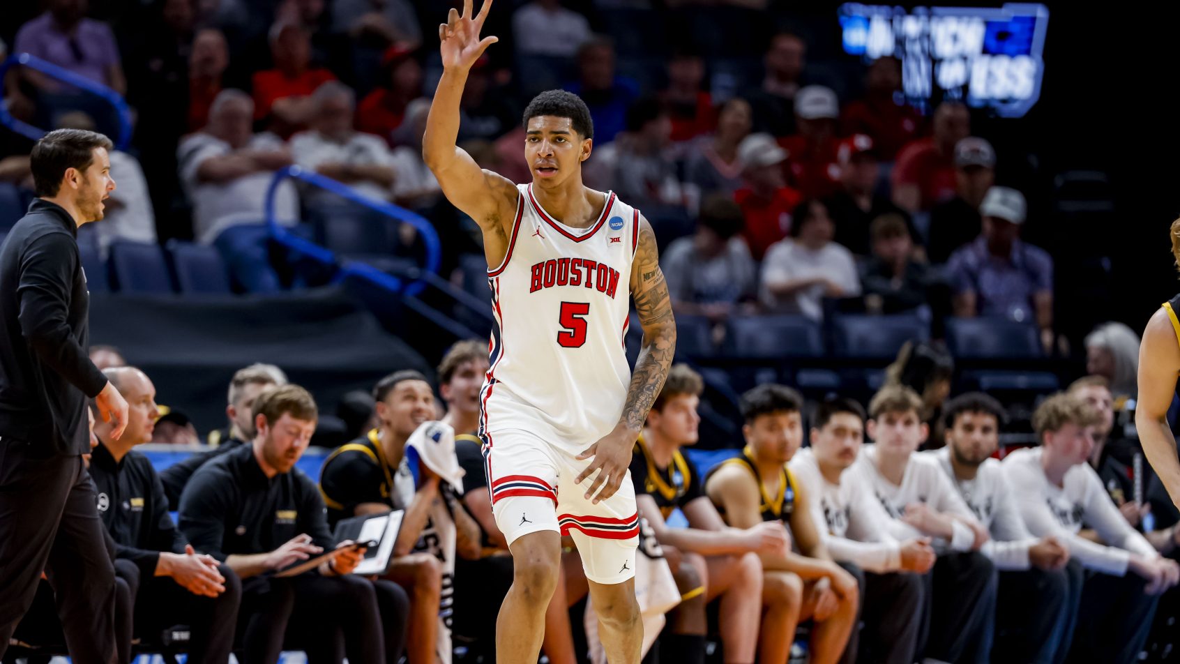 Chris Cenac Jr. celebrates a three pointer