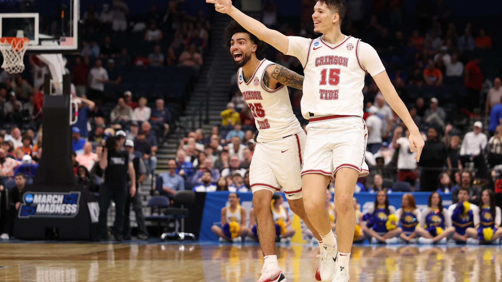 Alabama celebrates a 3-point bucket in their 1st Round March Madness victory over Hofstra.