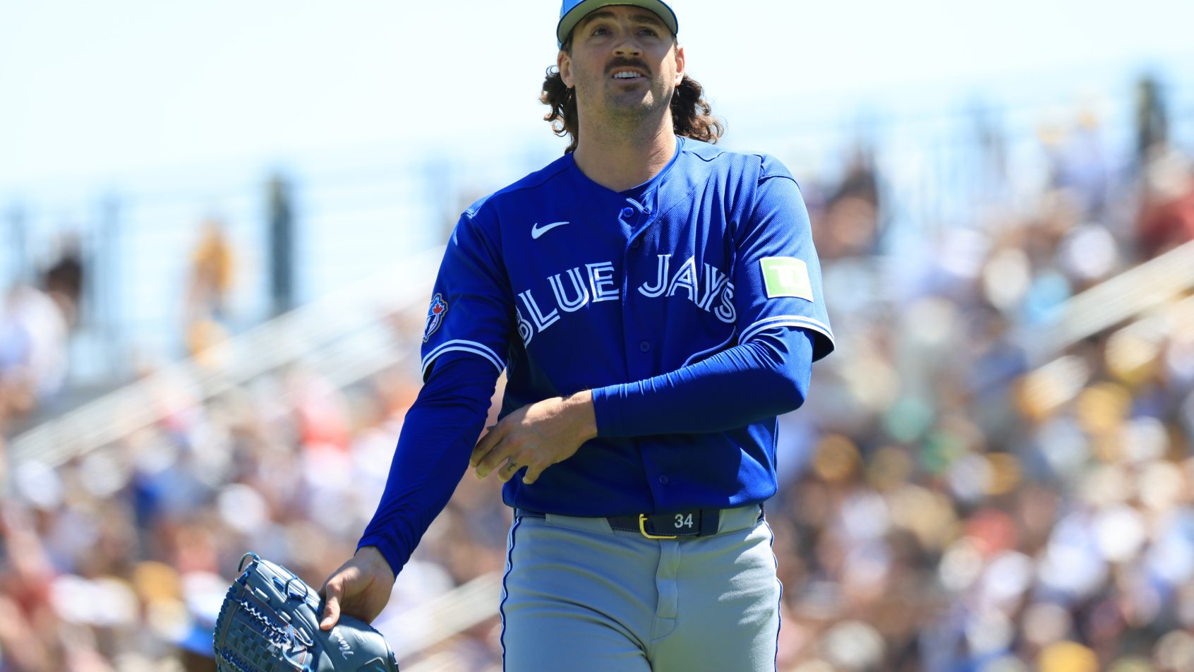 Kevin Gausman walks off the mound at the end of a Spring Training inning in a game versus the Pirates.