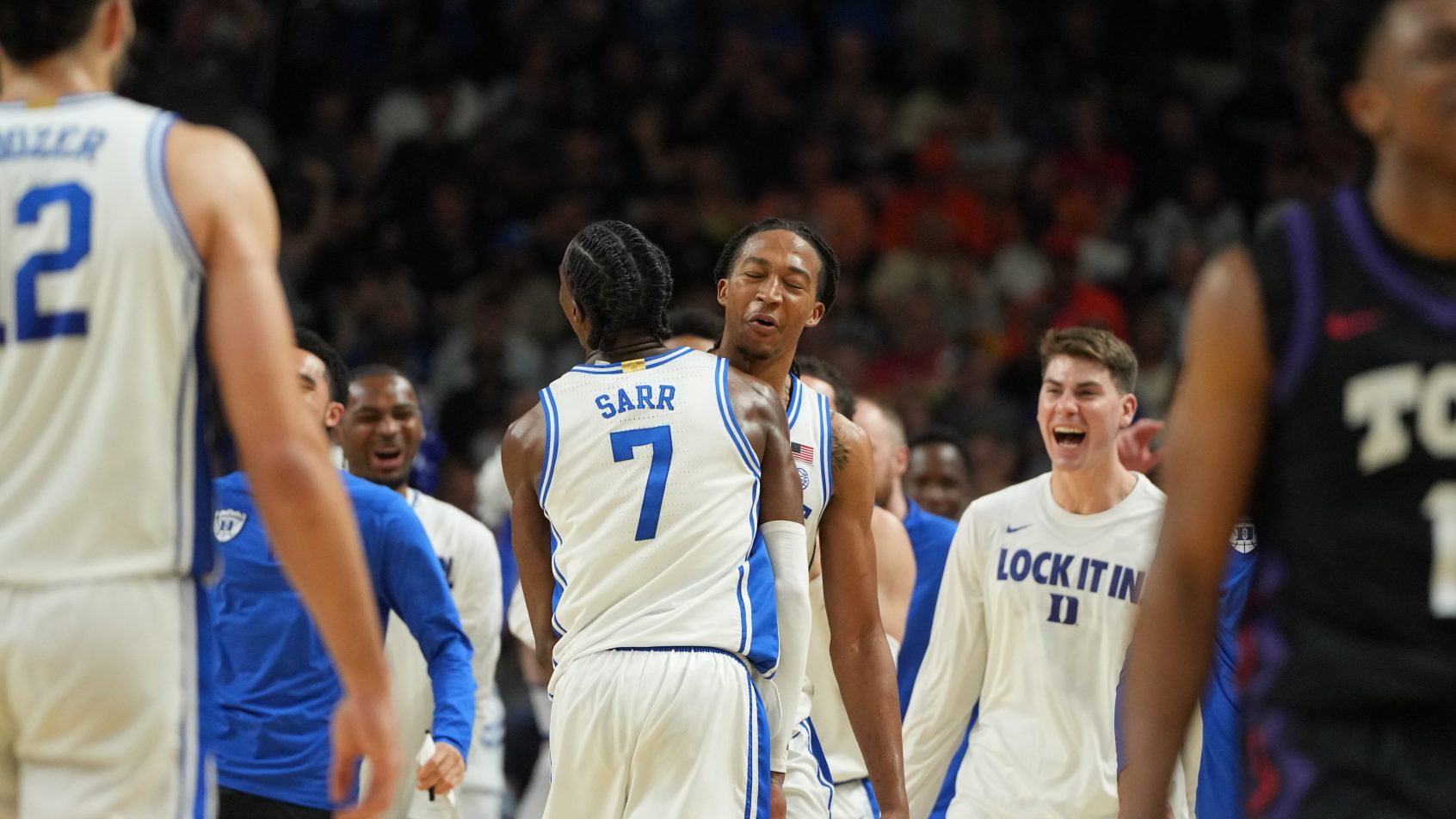Duke basketball celebrating with each other