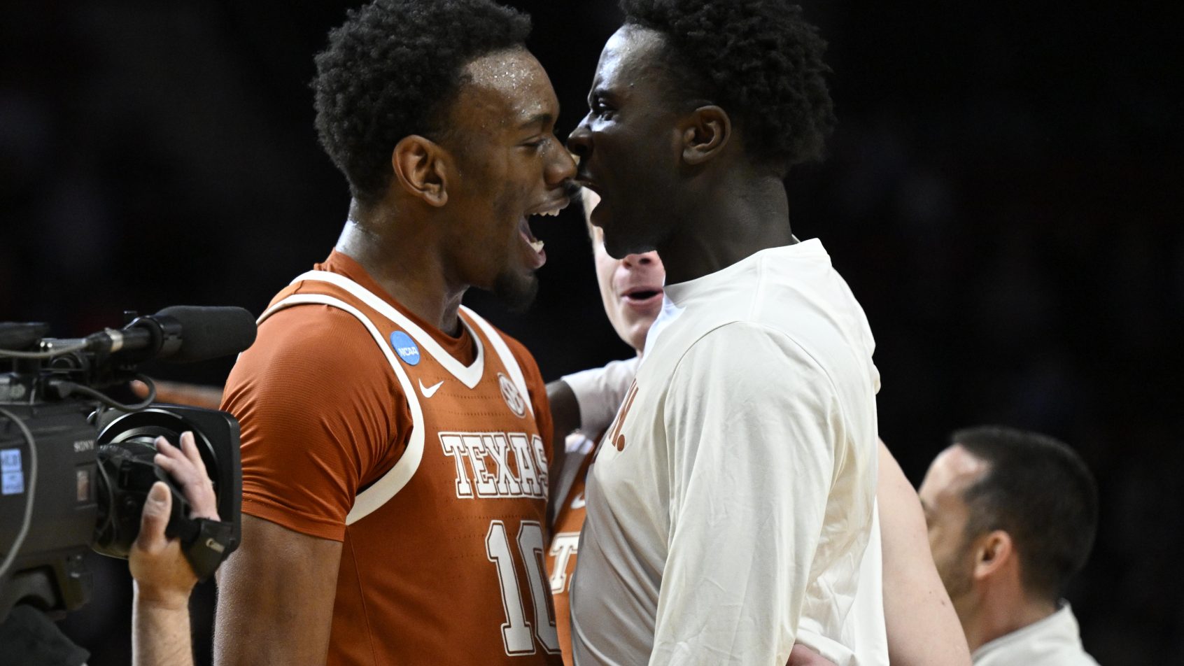 Texas Longhorns forward Nic Codie celebrates with teammates