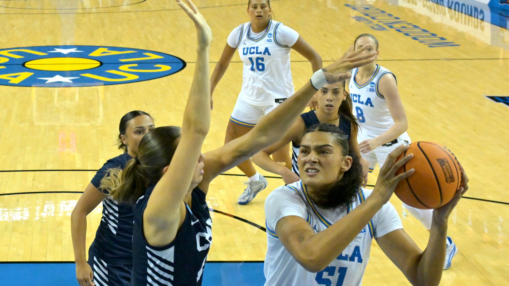 Lauren Betts with ball in the paint