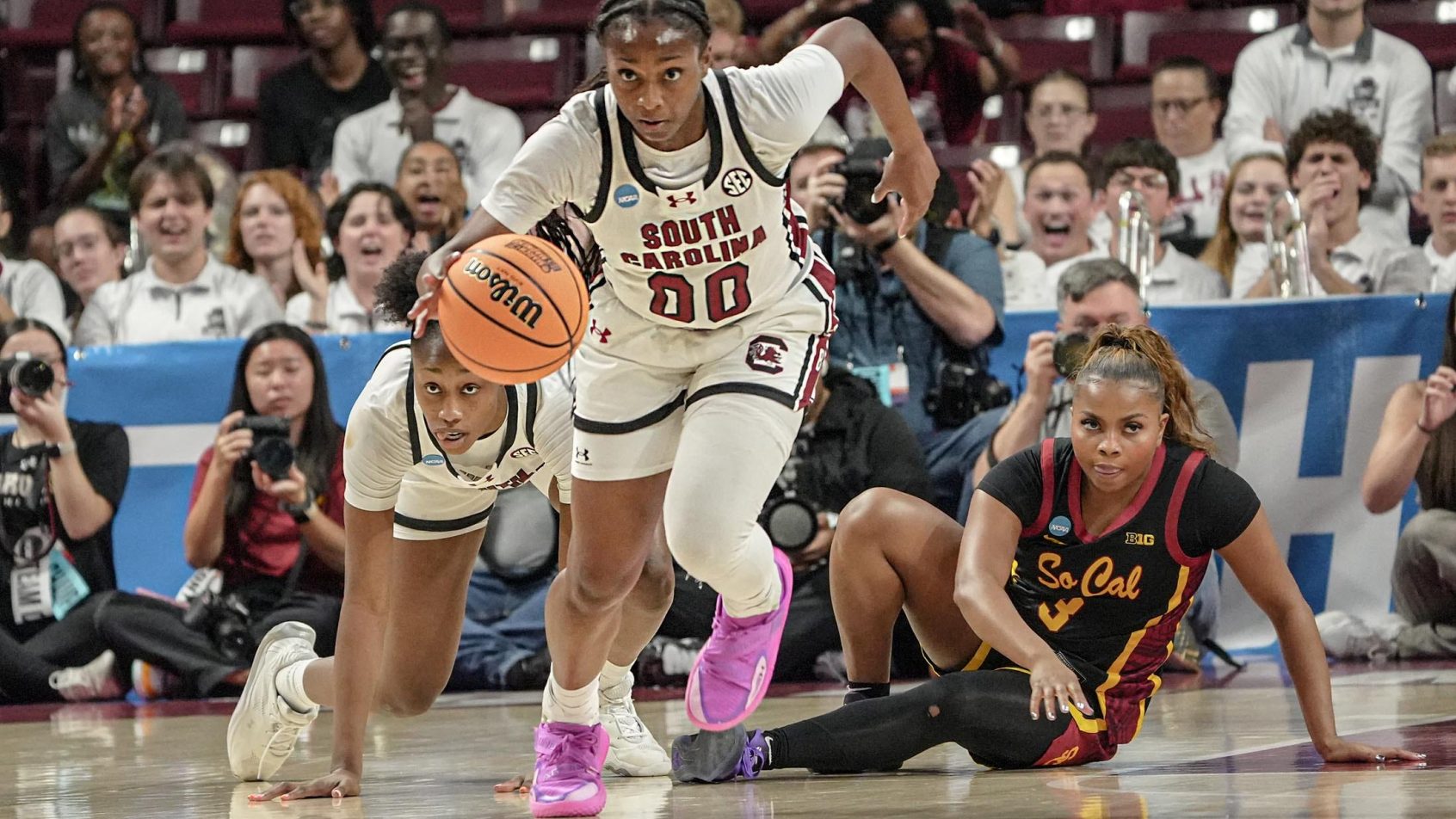 Ta'Niya Latson dribbling.