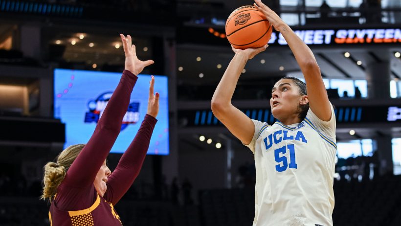 UCLA Bruins center Lauren Betts shooting over a defender