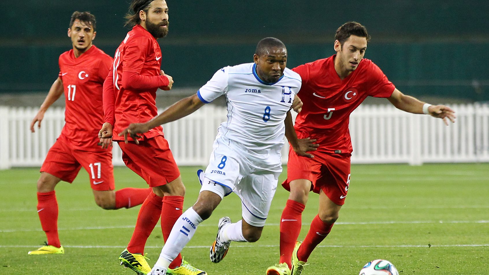 Turkey midfielder Hakan Calhanoglu chases the ball