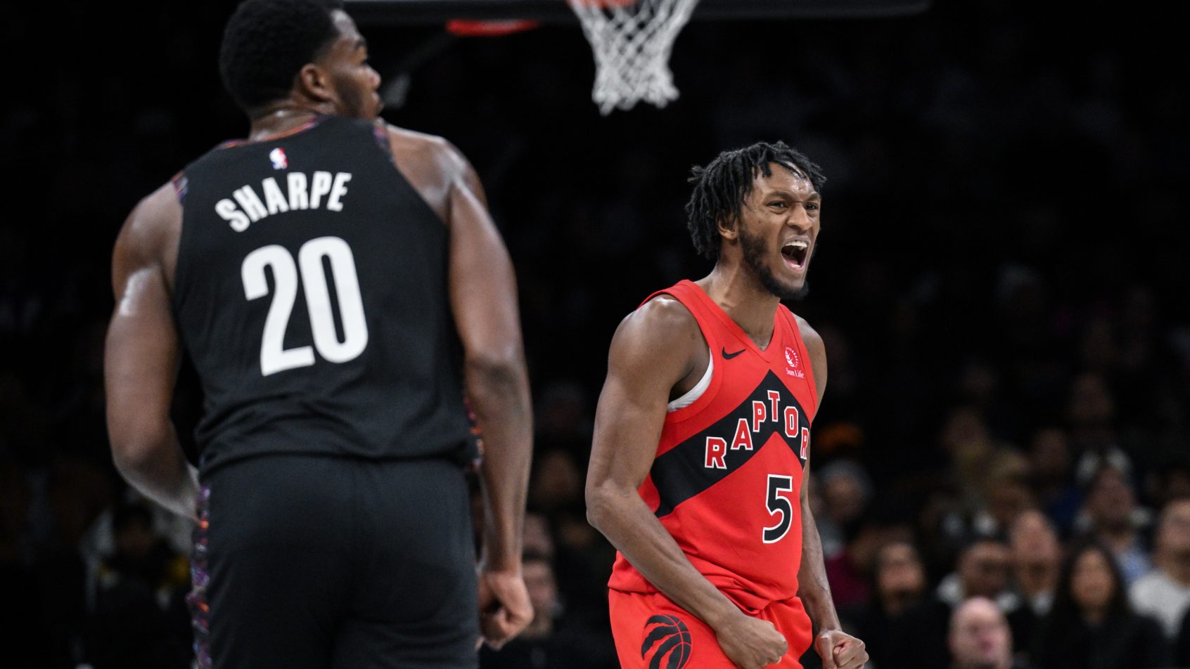 Toronto Raptors guard Immanuel Quickley celebrates