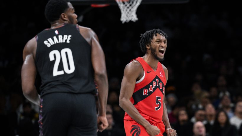 Toronto Raptors guard Immanuel Quickley celebrates
