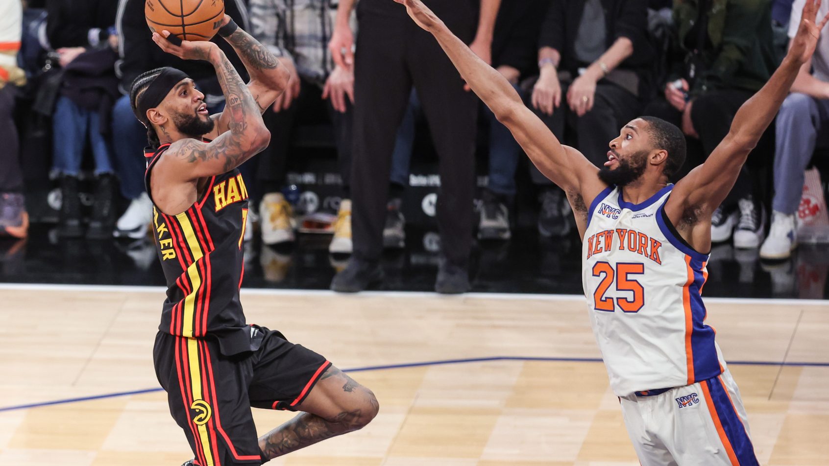 Nickeil Alexander-Walker shoots the basketball