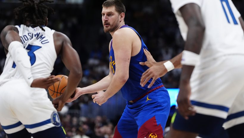 Denver Nuggets center Nikola Jokic making a pass